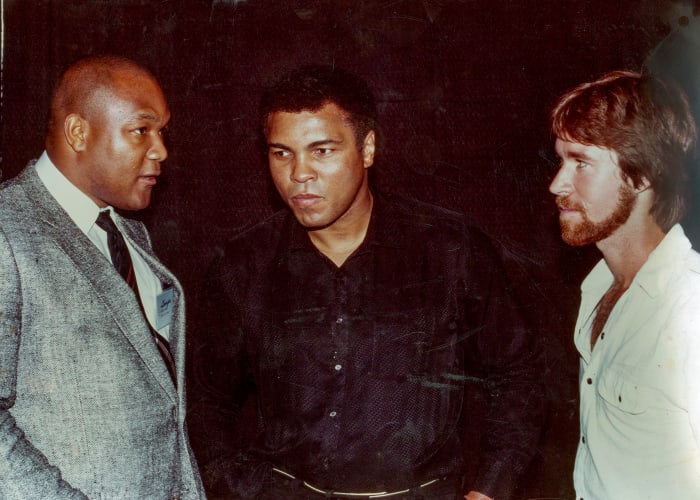In 1994, a decade after George Foreman’s famous fight against Muhammad Ali, Smith (far right) wrote about the affair.